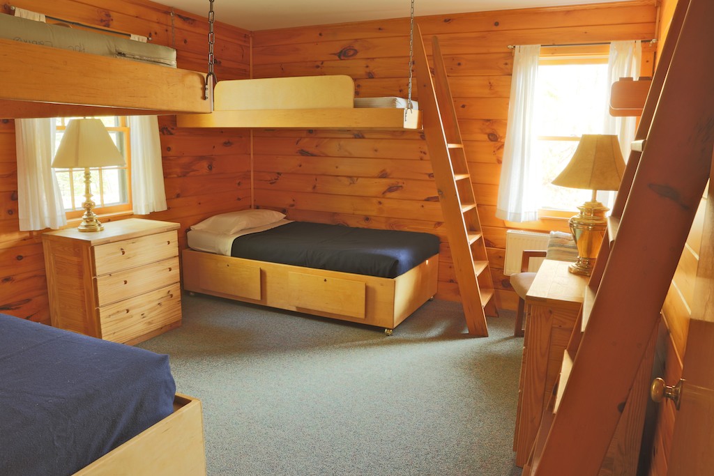Inside a wood cabin bedroom